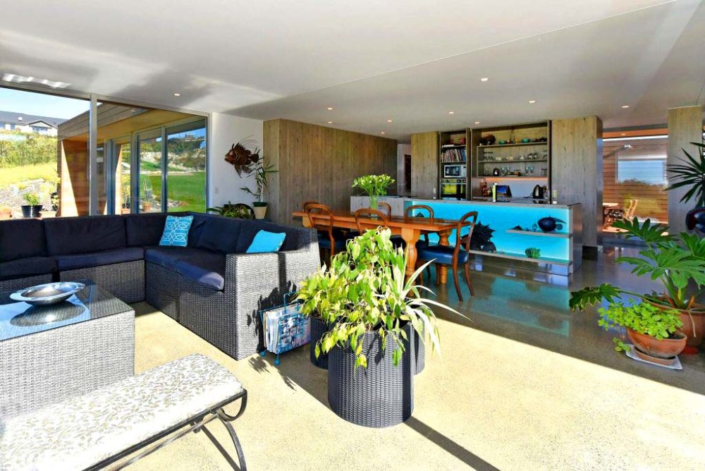 Open plan lounge dining kitchen viewed from deck