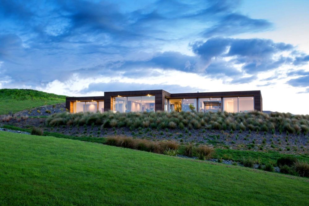 Front view of newly built modern wood clad and glass house